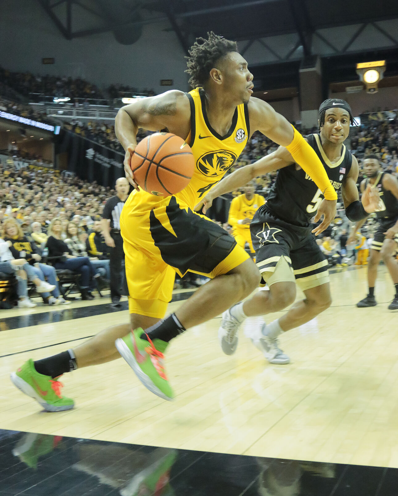 DeAndrew Gholston rushes the ball past Vanderbilt’s Ezra Manjon